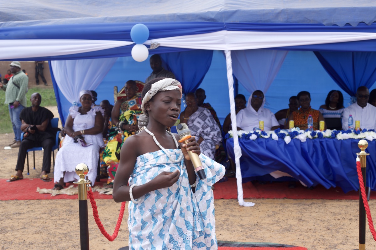 Young girl performing at the ceremony