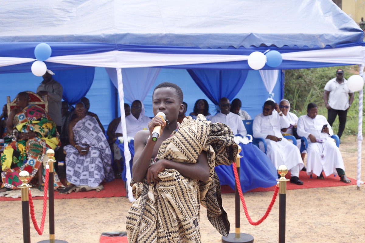 Boy performing at the ceremony