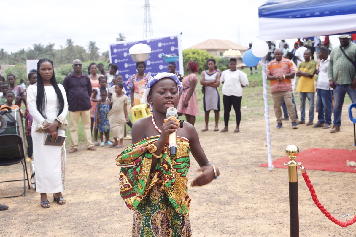 Girl speaking to the crowd at the ceremony